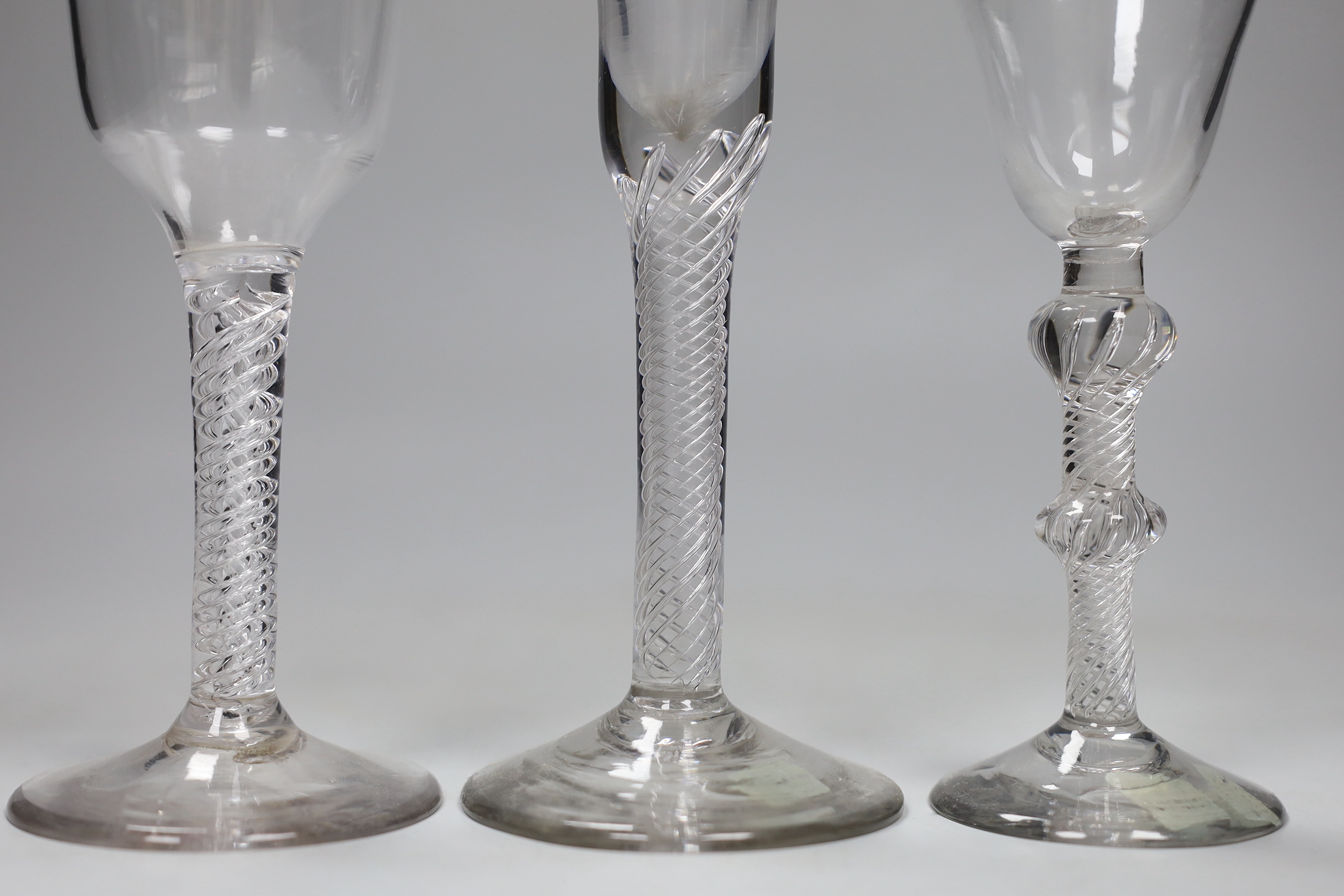 Three George II air twist stem wine or cordial glasses, tallest 17.5 cm high